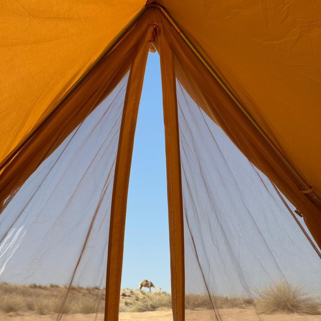 View out through the Bedouin bell tent mesh doorway to the desert