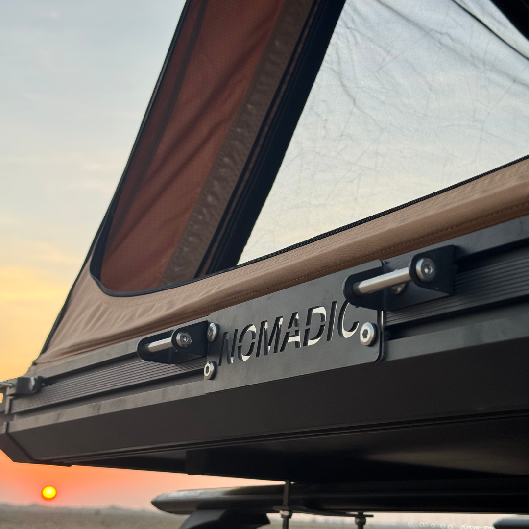 Detail of the Nomad rooftop tent aluminium shell, Nomadic lettering and latch hardware